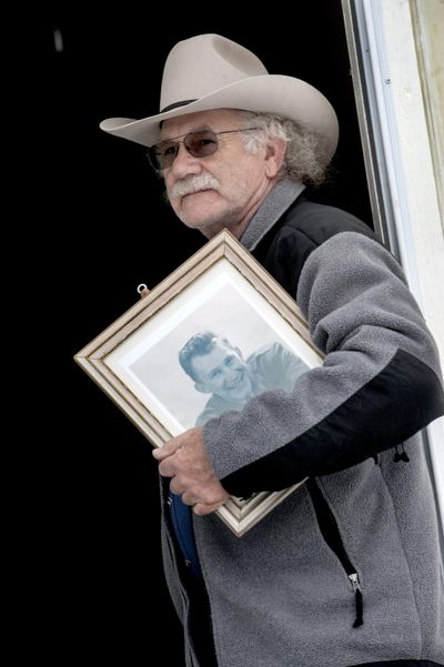 Andy Norberg holds a photograph of his father, Lt. Carl Edward Norberg, as he talks about searching for details of the plane crash that took his life in 1945. Andy was less than 6  months old when his father died in a Navy plane crash near Mount St. Helens. His body was never recovered. Andy is trying to piece together history ahead of a ceremony for his father at the Washington State Veterans Cemetery on Monday. (Kathy Plonka / The Spokesman-Review)