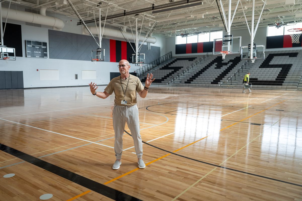 Greg Forsyth, director of capitol projects for Spokane Public Schools, gives a tour of the new Sacajawea Middle School, including the new gym which features three full basketball courts.  (COLIN MULVANY/THE SPOKESMAN-REVI)