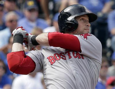 Daniel Nava connects on a grand slam during the sixth inning of Boston’s win over the Royals. (Associated Press)