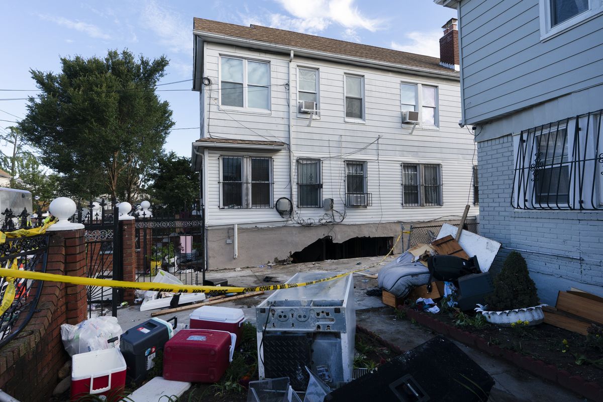 Damage to the side of a building from the remnants of Hurricane Ida is shown on Thursday, Sept. 2, 2021 in the Queens borough of New York. Three people were killed when several feet of water collapsed the wall to their basement apartment and flooded the apartment.  (Mark Lennihan)
