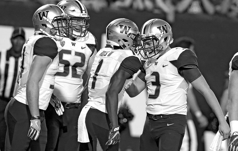 Washington wide receiver John Ross (1) celebrates with Jake Browning (3) after scoring a first-half touchdown against Arizona. (Rick Scuteri / Associated Press)