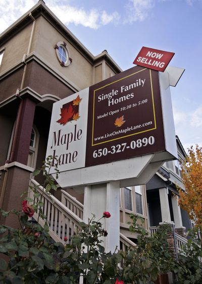 A new home is shown in East Palo Alto, Calif. Sales of new homes fell in November to the slowest pace in nearly 18 years, while new home prices dropped by the biggest amount in eight months.  (Associated Press / The Spokesman-Review)