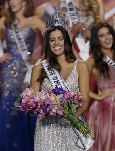 Miss Colombia Paulina Vega smiles as the crown is placed on her head as she becomes Miss Universe in Miami on Sunday. (Associated Press)