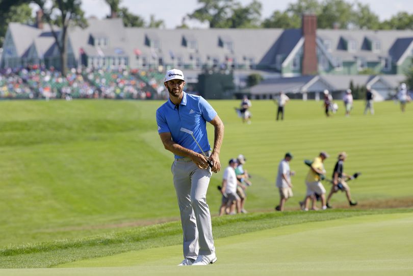 Dustin Johnson watches his putt on the 14th green during the rain-delayed second round of the U.S. Open golf championship at Oakmont Country Club on Friday. (Gene J. Puskar / Associated Press)