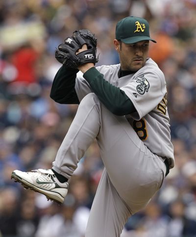 A’s Justin Duchscherer handcuffed Mariners on two hits to spoil Opening Day at Safeco.  (Associated Press)