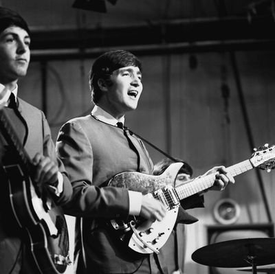 Paul McCartney, left, and John Lennon play a live show on Oct. 4, 1963. (PRKS/UPPA / Tribune News Service)
