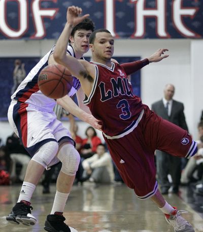 Loyola Marymounts' Anthony Ireland, right, and Saint Marys' Clint Steindl chase a loose ball in the second half of an NCAA college basketball game Wednesday, Feb. 15, 2012, in Moraga, Calif. (Ben Margot / Associated Press)