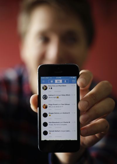 Alex Culbertson, 26, shows transactions via the Venmo app on his smartphone Friday in Boston. On a recent trip to Maine with six friends, Culbertson used Venmo to split up a weekend tab of gas, hotel rooms, food and drink. (Associated Press)