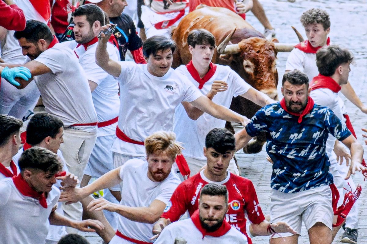 Elliott Browning, fourth from left bottom row, runs with the bulls in Spain.  (COURTESY PHOTO)