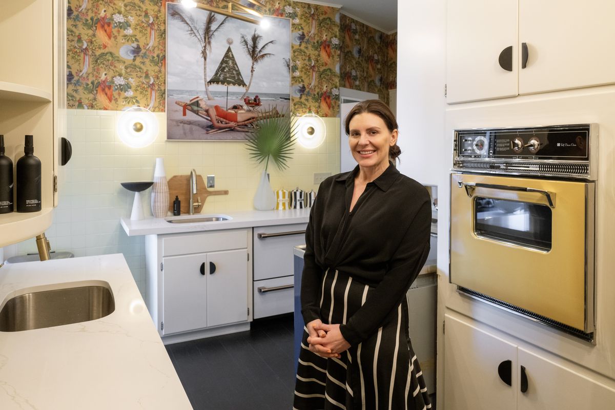 Erin Haskell and her husband Zach Gourde recently bought a South Hill house built in 1925, where one of The Spokesman-Review’s “Dorothy Deans,” Edna May Brown, once lived. Haskell decided to maintain the kitchen as it existed at the time of Edna Mae in 1938, including the mustard yellow range, yellow backsplash and original cabinets.  (COLIN MULVANY/THE SPOKESMAN-REVI)