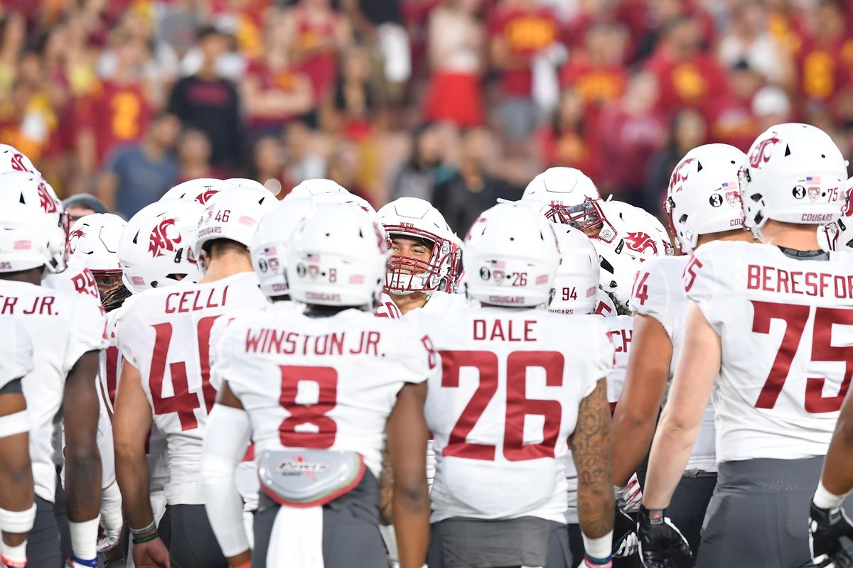 WSU huddles and cheers before the first half of a college football game against USC on Friday, September 21, 2018, at LA Memorial Coliseum in Los Angeles, Calif. (Tyler Tjomsland / The Spokesman-Review)
