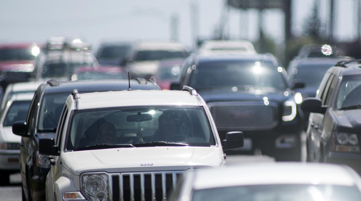 Cars and trucks, and the fumes from the gasoline that powers most of them, contribute to the formation of ozone in the local atmosphere, expecially when the temperatures soar into the 90s in the summer time. Ozone is component of unhealthy air and can cause lung irritation. Photographed on Division Street Friday, July 7, 2017. (Jesse Tinsley / The Spokesman-Review)