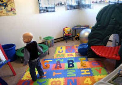 
Gabriel Quaschnick sees his new playroom for the first time at the home his family will live in rent-free for a year. 
 (Holly Pickett / The Spokesman-Review)
