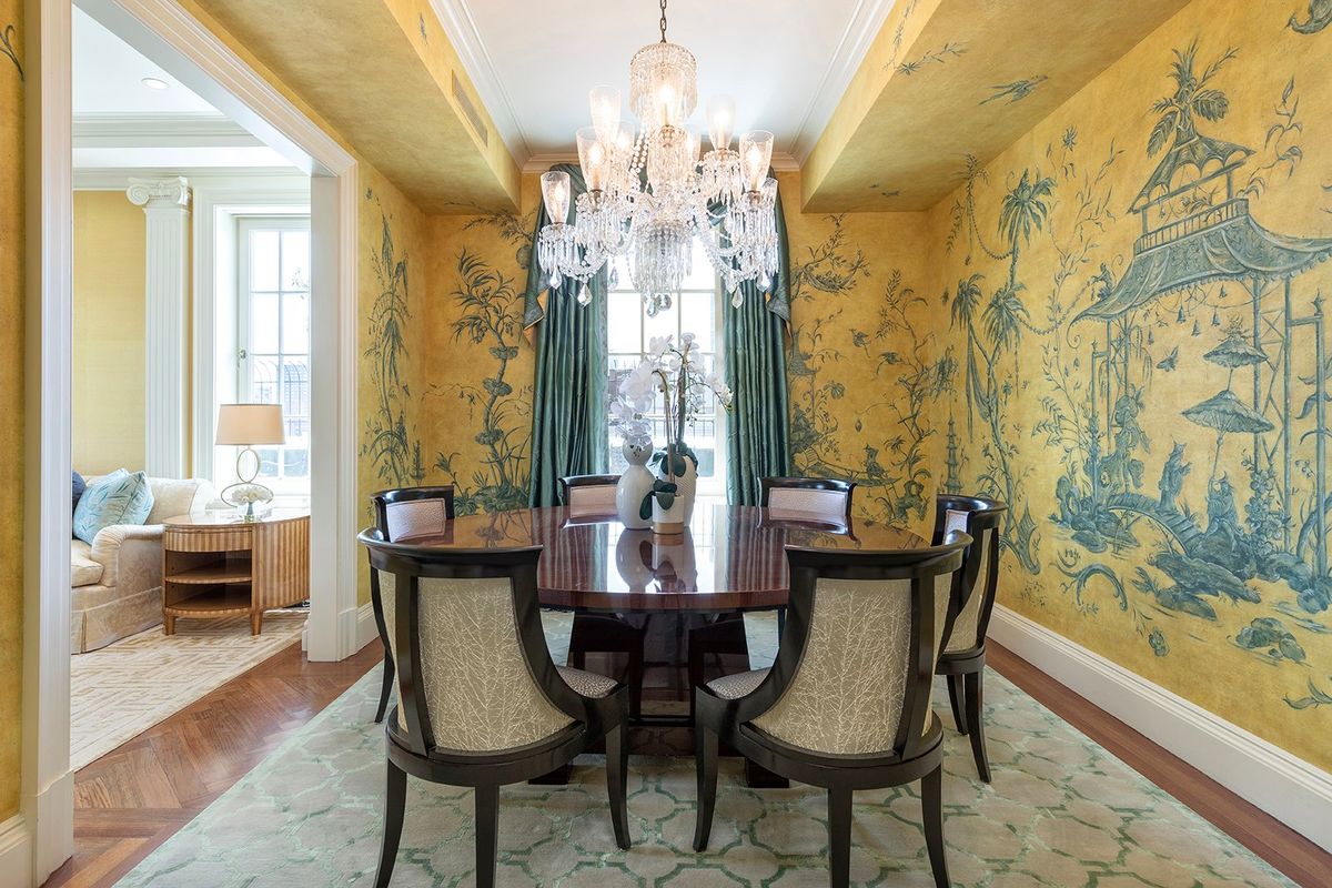 A glossy wood round table and elegant chairs helps to create a formal and luxurious feel in this dining space. (Handout/TNS)  (Handout)