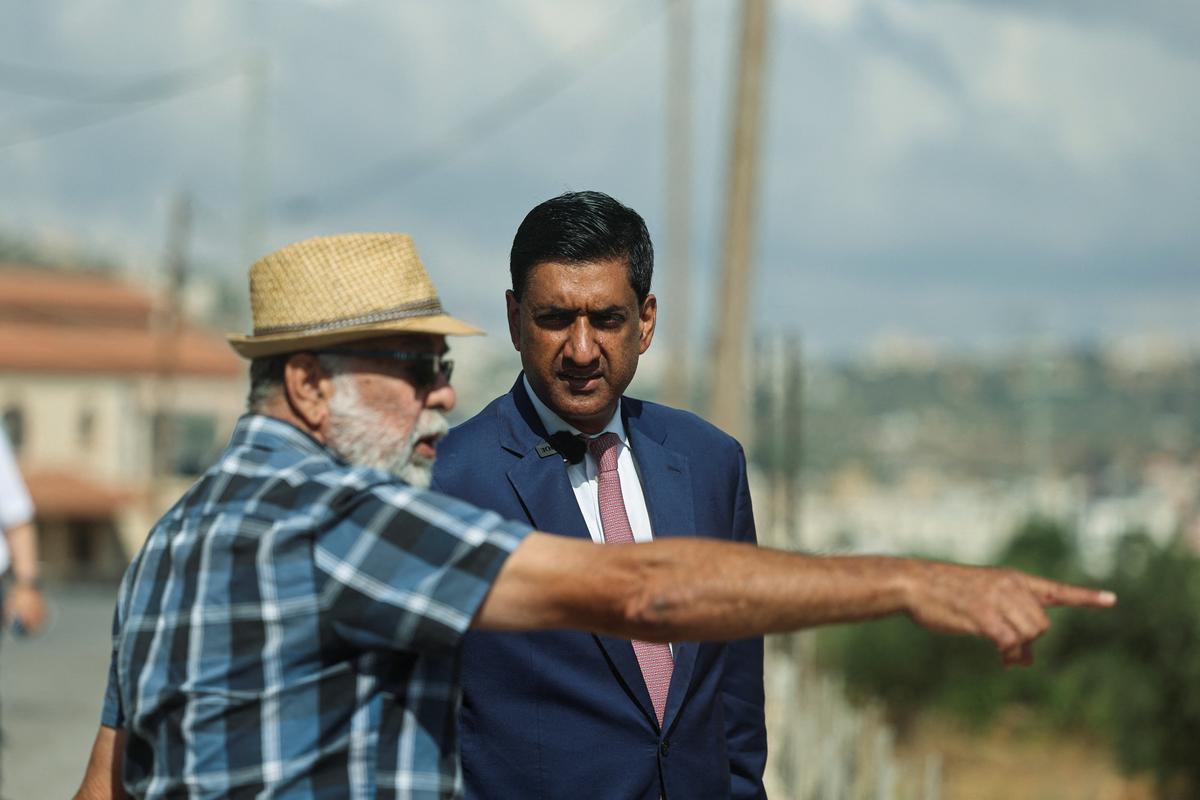 U.S. Rep. Ro Khanna, D-Calif., speaks with a Palestinian resident of Turmus Ayya, near Ramallah, during a visit Thursday in the Israeli-occupied West Bank.  (Reuters )