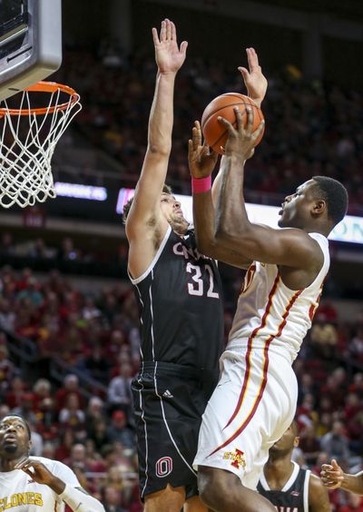Iowa State guard Deonte Burton puts up a shot over Nebraska-Omaha forward Daniel Meyer during the first half of an NCAA college basketball game, Monday, Dec. 5, 2016, in Ames, Iowa. Burton scored the first 13 points for Iowa State. (Justin Hayworth / Associated Press)