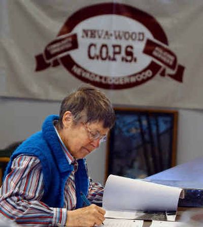 
Anita Messex files reports on graffiti she has found in the Nevada-Lidgerwood neighborhood. Messex is one of many volunteers who help out at the northside COPS shop. Anita Messex files reports on graffiti she has found in the Nevada-Lidgerwood neighborhood. Messex is one of many volunteers who help out at the northside COPS shop. 
 (Photos by Christopher Anderson/Photos by Christopher Anderson/ / The Spokesman-Review)