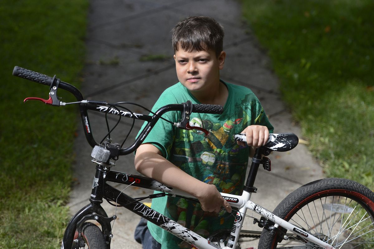 Aaron Crummett, 9, hopes he can hold onto this bike. He’s had three bicycles stolen from his east Spokane home, most recently in May. (Dan Pelle)