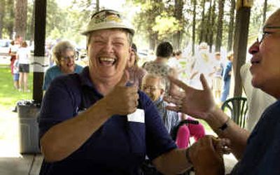 
Sally Revious gives the thumbs-up to Vicki Brigman at the Edna E. Davis School reunion Saturday. 
 (Jed Conklin / The Spokesman-Review)