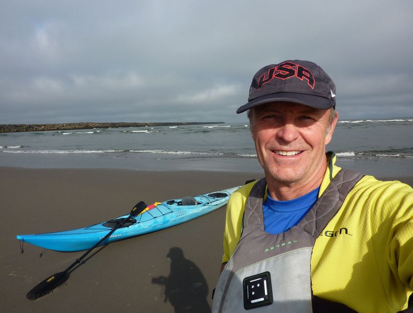 John Roskelley of Spokane prepares to launch his kayak on the Columbia River, which he measured at 1,200 miles.