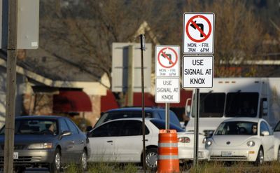 A motorist makes an illegal left turn off Argonne onto Indiana  on Thursday morning. Spokane Valley police have begun citing drivers who fail to heed the turning restriction. (J. Bart Rayniak / The Spokesman-Review)