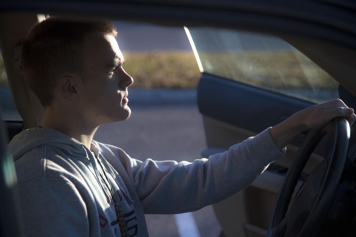 Hayden Stipe, 17, sits behind the wheel of a 2003, Subaru Forester that he hopes to drive with the help of the Car-Aid device. Stipe has cerebral palsy and the technology will allow his to drive through the use of a joystick. (Dan Pelle / The Spokesman-Review)