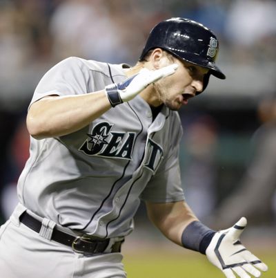 Seattle’s Mike Zunino reacts after hitting a two-run home run in the eighth inning to give the M’s the lead. (Associated Press)