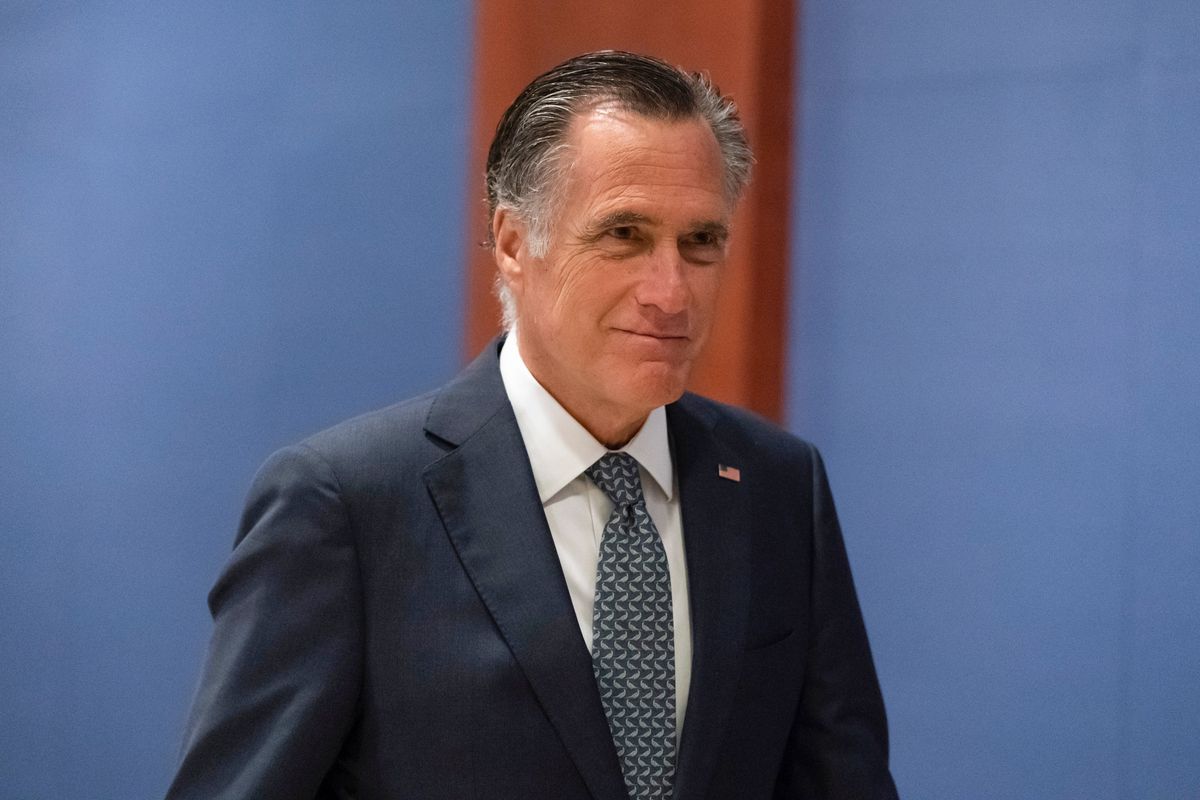 FILE - Sen. Mitt Romney, R-Utah, arrives to watch a speech by Ukrainian President Volodymyr Zelenskyy live-streamed into the U.S. Capitol, in Washington, March 16, 2022. Lawmakers seemed on the brink of clinching a bipartisan compromise Thursday, March 31, to provide a fresh $10 billion to combat COVID-19. Romney said bargainers had reach an agreement in principle on a package but said it was still being drafted. Other senators were less definitive but none contested that a deal was near.  (Alex Brandon)