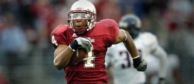 
WSU receiver Brandon Gibson takes off on a 91-yard touchdown. 
 (Christopher Anderson / The Spokesman-Review)