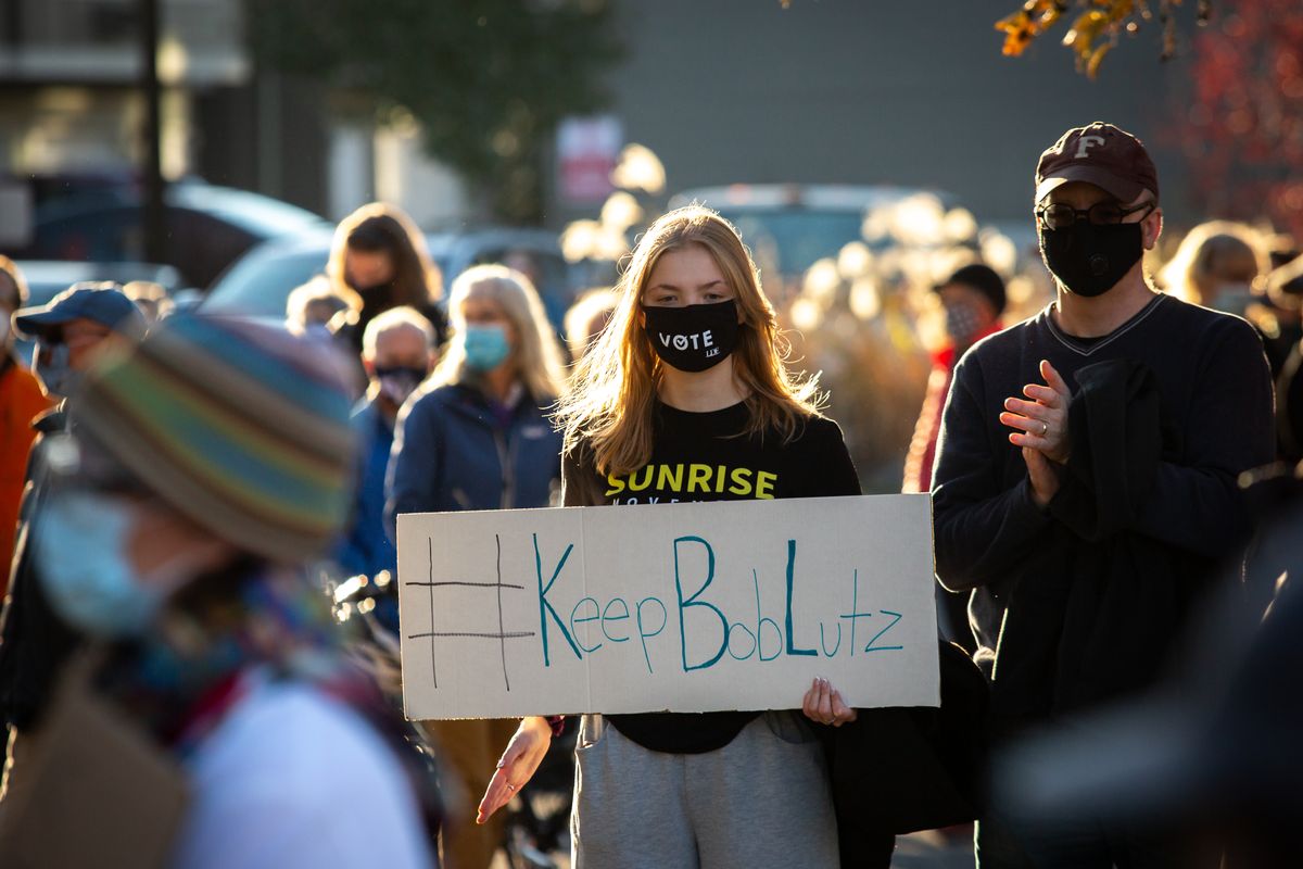 A protester holds a sign in favor of Health Officer Bob Lutz during a protest against the Spokane Board of Health’s ousting of Lutz, held on Nov. 1, 2020 outside the Spokane Regional Health District office. News of the controversial situation broke on Friday, and Lutz has since said that he will not resign and has acquired an attorney in order to keep his employment with the SRHD in the middle of the COVID-19 pandemic.  (Libby Kamrowski/ THE SPOKESMAN-REVIEW)