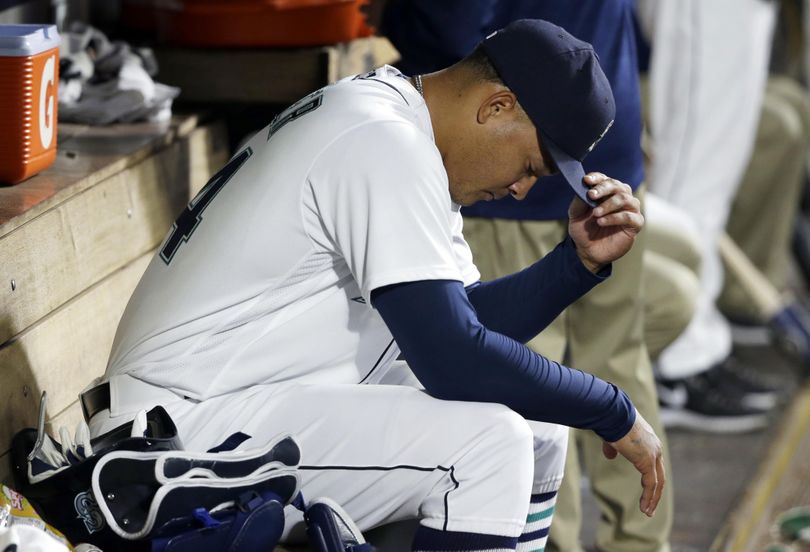 Seattle Mariners starting pitcher Taijuan Walker sits in the dugout after he was pulled from Monday’s game in the eighth inning. (Ted S. Warren / Associated Press)
