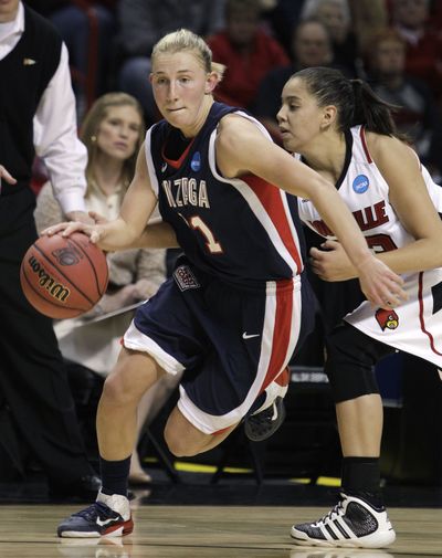 Gonzaga's Courtney Vandersloot, left, drives past Louisville's Shoni Schimmel in the first half of an NCAA women's college basketball tournament regional semifinal, Saturday, March 26, 2011, in Spokane, Wash. (Elaine Thompson / Associated Press)