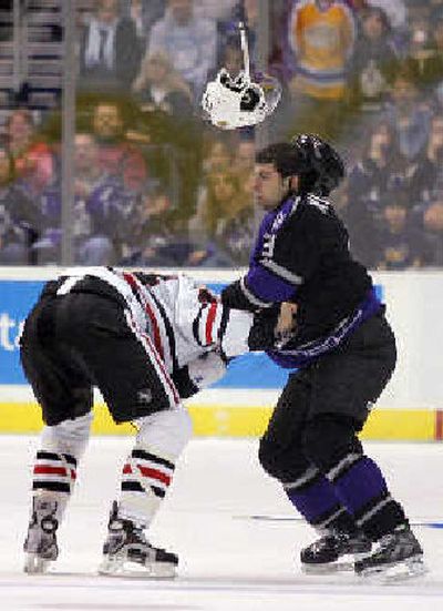 
Tom Kostopoulos, right, of Los Angeles fights with Chicago's Danny Richmond. 
 (Associated Press / The Spokesman-Review)
