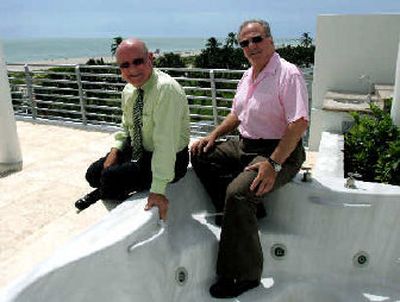 
Developers Gene Grabarnick, left, and Ronald Molko sit on the edge of a hot tub that is incuded in a penthouse room at the Regent South Beach hotel in Miami Beach, Fla., last month. 
 (Associated Press / The Spokesman-Review)