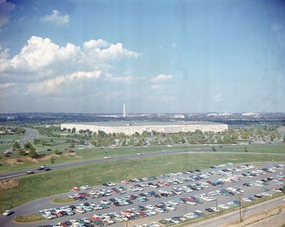 This undated file photo shows the Pentagon, headquarters of the U.S. Department of Defense, with the Washington Monument in background and a large parking lot in foreground, in Arlington, Va. (STF)