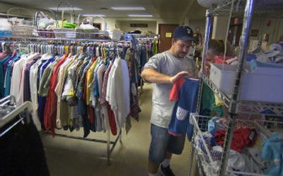 
Rebecca Strantz and Mike Cowart use the clothing bank at the Spokane Valley Community Center Wednesday as they shop for baby clothes and other items. In next year's budget, the Spokane Valley City Council gave the center $7,000. The center had requested more than $14,000 in funding from the city.
 (Christopher Anderson/ / The Spokesman-Review)