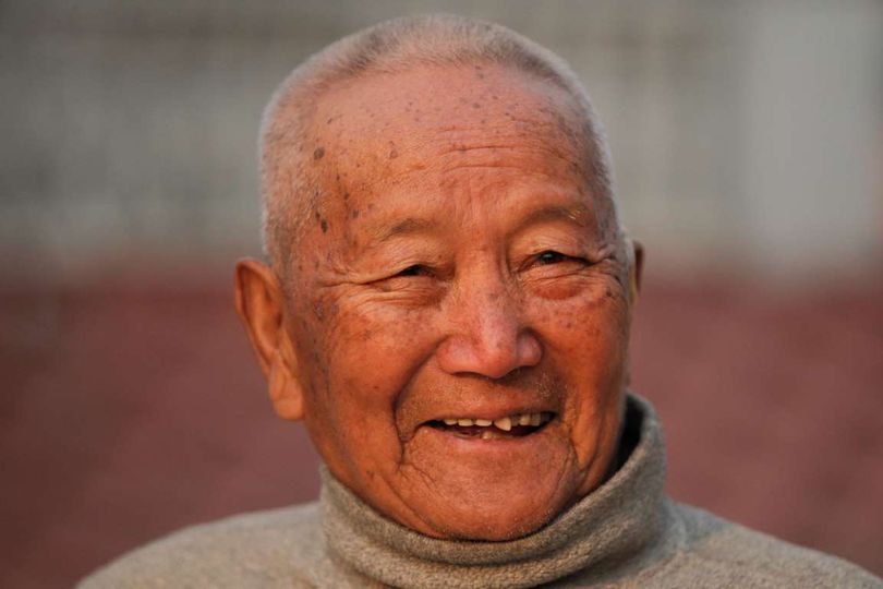 In this April 12, 2017 file photo, Nepalese mountain climber Min Bahadur Sherchan, 85, smiles as he finishes his morning yoga workout at his residence in Kathmandu, Nepal.  (Associated Press)