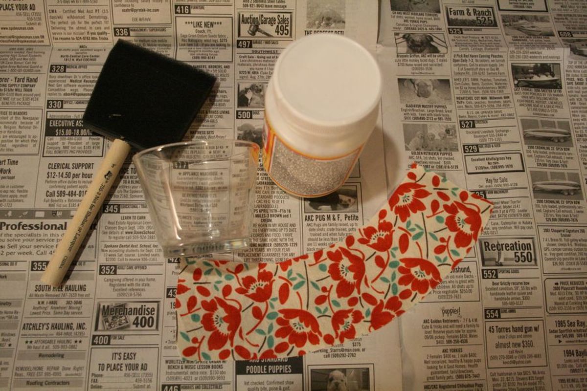 To make the fabric-covered candle holders, you will need fabric scraps, Mod Podge or a similar decoupage glue, scissors, a sponge brush and a glass candle holder. This candle holder was purchased at a secondhand store for 69 cents. (Megan Cooley)