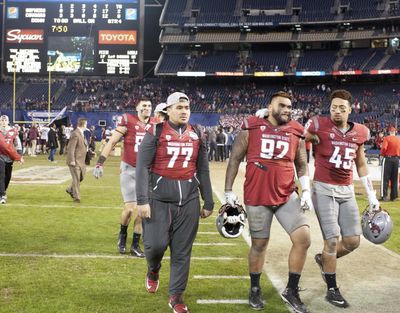 Washington State Cougars nose tackle Robert Barber (92) walks off the field after falling to Minnesota during the 2016 Holiday Bowl on Tuesday, Dec. 27, 2016. (Tyler Tjomsland / The Spokesman-Review)