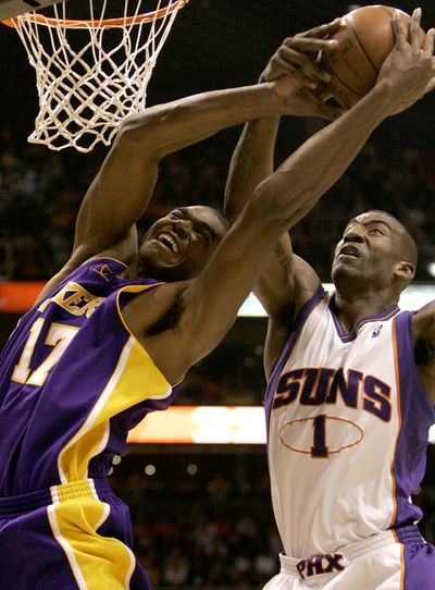 Los Angeles Lakers’ Andrew Bynum has his shot blocked by Phoenix’s Amare Stoudemire during the first quarter Thursday night in Phoenix.  (Associated Press / The Spokesman-Review)
