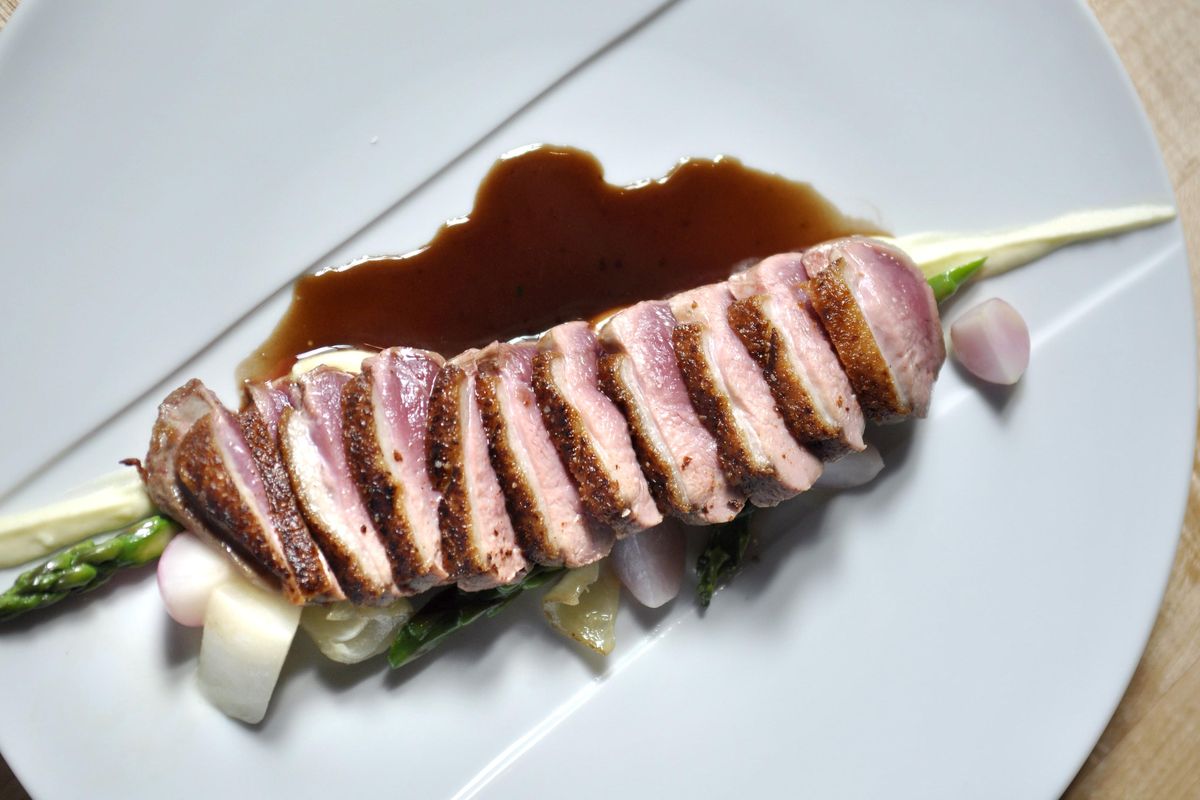 The duck breast at Park Lodge comes with asparagus and root vegetables. (Adriana Janovich / The Spokesman-Review)