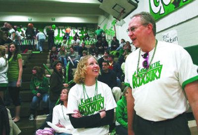 
East Valley High Principal Jeff Miller talks to an East Valley fan during the spirt competition against Rogers High School last month. Miller served for five years as assistant principal before becoming the school's principal in 1994. He is the Valley's longest-tenured principal at the same school.
 (Amanda Smith / The Spokesman-Review)