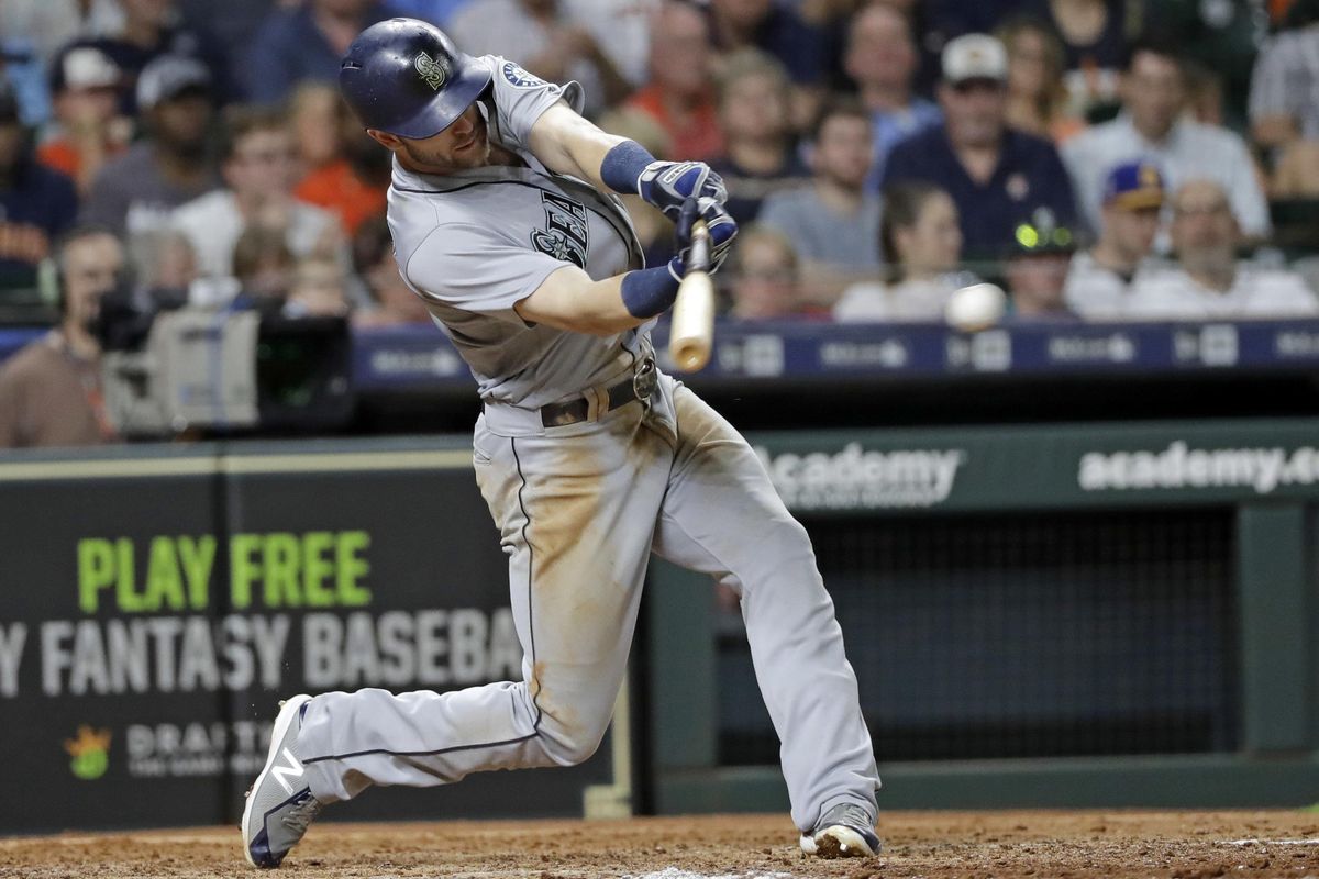 Seattle Mariners' Mitch Haniger hits an RBI single against the Houston Astros during the sixth inning of a baseball game Thursday, Aug. 9, 2018, in Houston. (David J. Phillip / AP)
