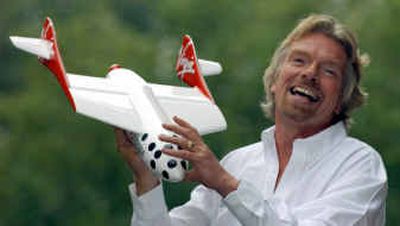 
British entrepreneur Richard Branson poses for photographers after he announced in London on Monday that his Virgin company plans to launch commercial space flights over the next few years. 
 (Associated Press / The Spokesman-Review)