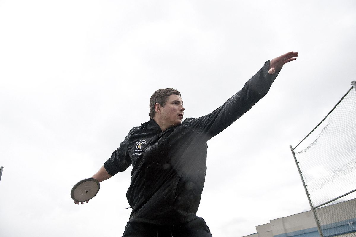 Coeur d’Alene High School senior Grady Leonard throws the discus during practice on Wednesday. Leonard is one of the best throwers in the nation and has broken school records in the shot put and discus. (Kathy Plonka / The Spokesman-Review)