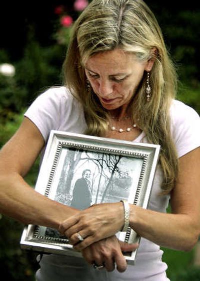 
Julie McMurchie holds a photo of her mother, Peggy Sutherland, at her Portland home in  Aug. 2005. In 2001, McMurchie watched her 68-year-old mother kill herself by swallowing a fatal barbiturate. Associated Press
 (File Associated Press / The Spokesman-Review)