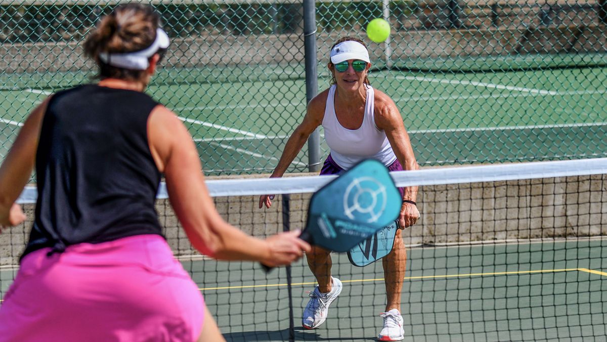 Laura Harrison eyes a return while playing pickleball at Cherry Hill Park in Coeur d’Alene on June 27.  (Kathy Plonka/The Spokesman-Review)