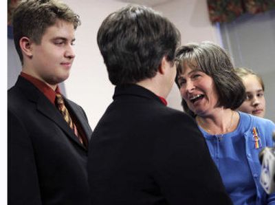 
Maureen Kilian, center right, reacts as her partner, Cindy Meneghin, asks to marry her during a news conference in Newark, N.J., Wednesday. Meneghin and Kilian were one of seven same-sex couples who sued the courts for the right to marry. 
 (Associated Press / The Spokesman-Review)