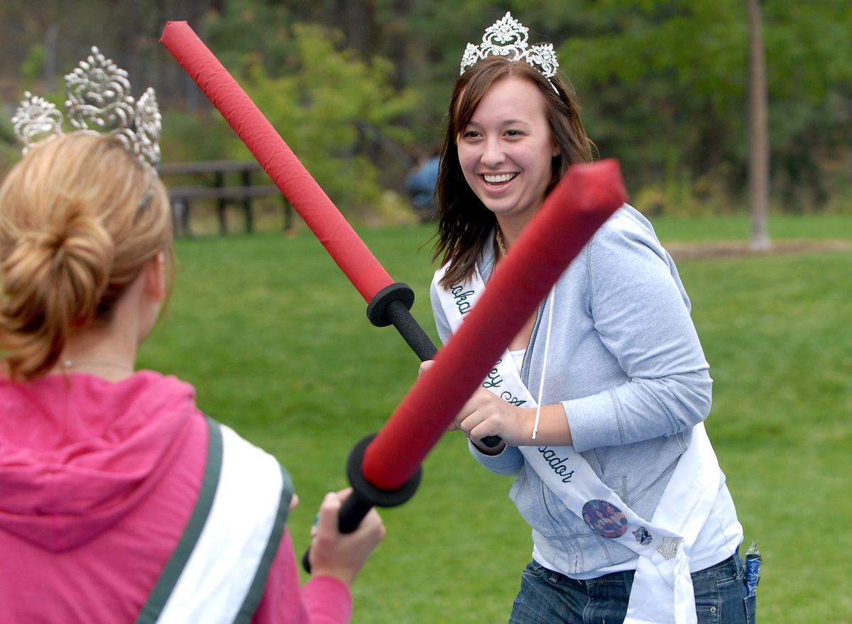 Nicole Luth, 17, wields a padded sword against Lauren Aubertin at the Spirit Martial Arts booth at Valleyfest on  Saturday.  (Jesse Tinsley / The Spokesman-Review)