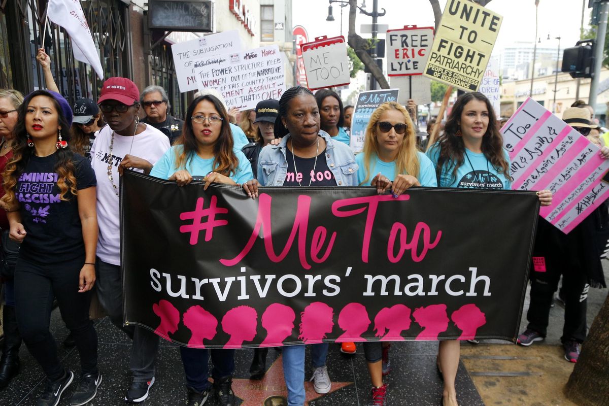 Tarana Burke, center, and other women march against sexual assault and harassment at the #MeToo Survivors’ March in the Hollywood section of Los Angeles on Nov. 12, 2017. Burke, a social activist who works for the Brooklyn-based nonprofit Girls for Gender Equity, is scheduled to speak with Ronan Farrow at Gonzaga University on April 20. (Damian Dovarganes / AP)